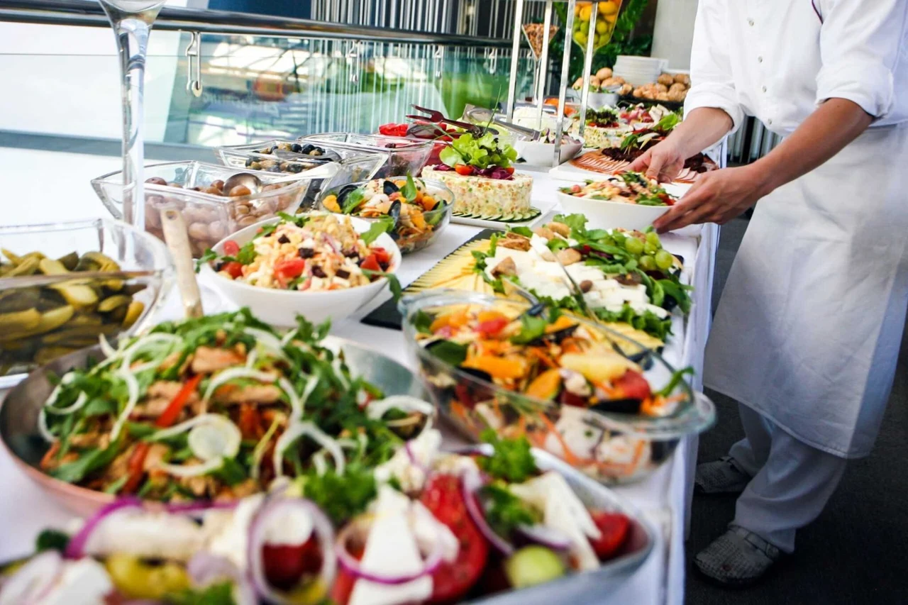 Chef preparing a fresh buffet in a professional kitchen