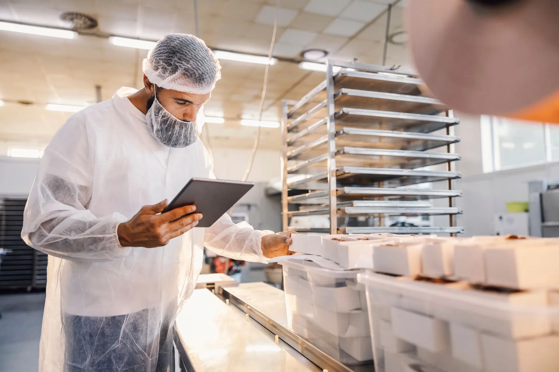 Rasa Foods quality supervisor checking food production standards